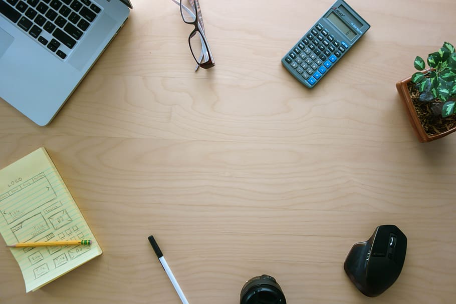 Minimalistic Home Office Setup with Office Essentials nicely Organized of a Flat Wooden Office Desk. HD wallpaper