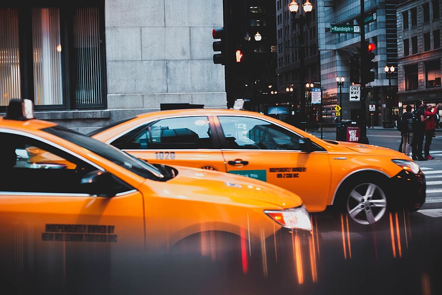 photo of two yellow cabs