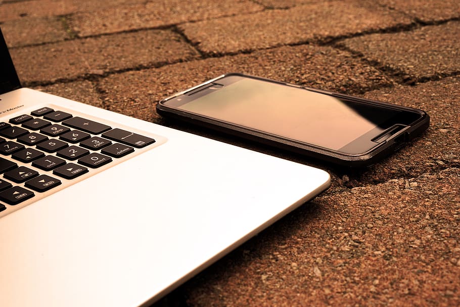 Silver Laptop Computer Beside Black Android Smartphone Turned Off HD wallpaper