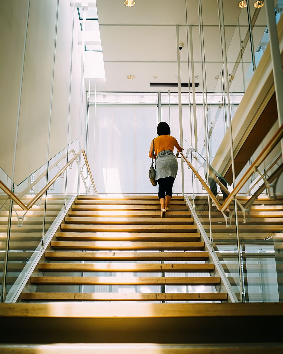 Woman Walking on Brown Stair, architecture, building, daylight HD wallpaper