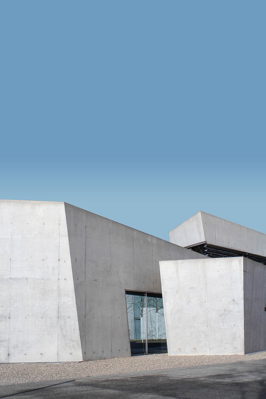 white concrete building under blue sky during daytime, architecture