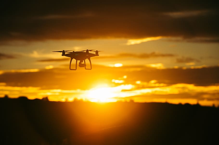 silhouette camera drone flying midair, sunset, sky, cloud - sky