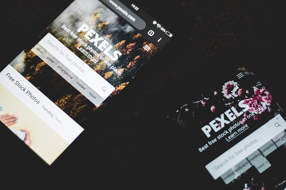 Two Turned-on Smartphone Displaying Pexels Application, close-up HD wallpaper