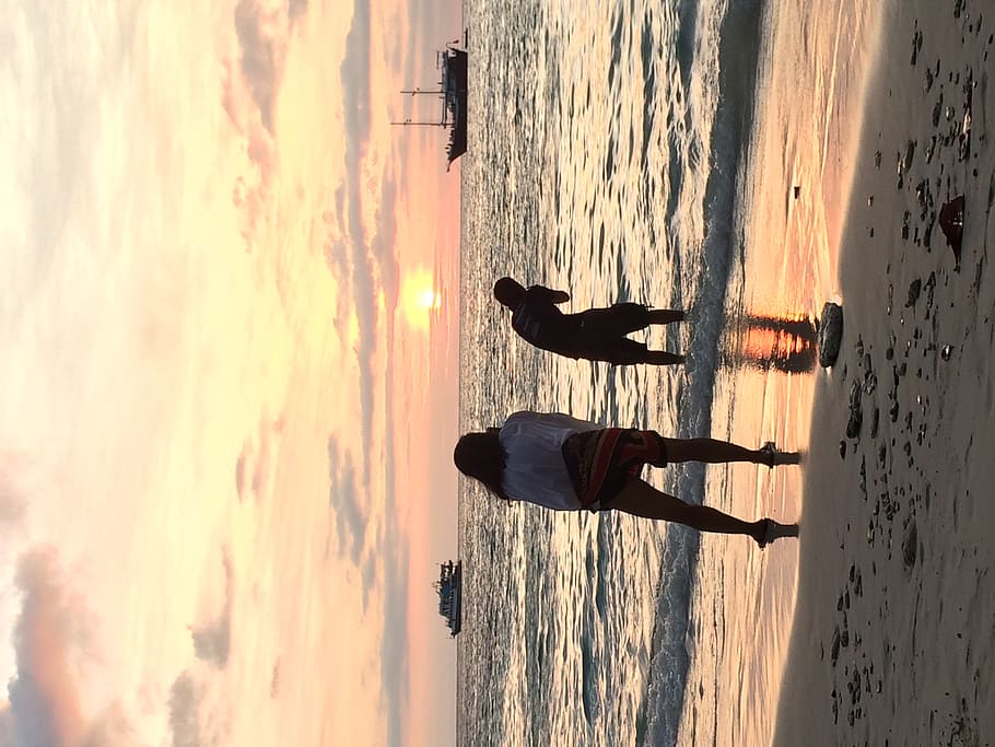 water, sea, sunset, sky, real people, beach, beauty in nature HD wallpaper