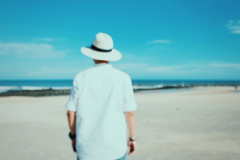 person standing on beach, apparel, clothing, hat, human, sun hat HD wallpaper