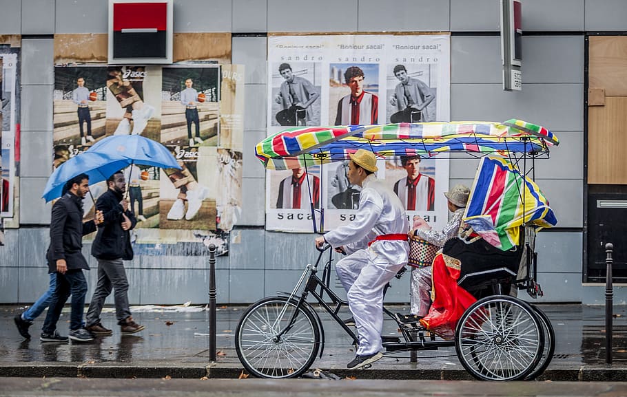 man holding umbrella, person, human, bicycle, transportation, HD wallpaper