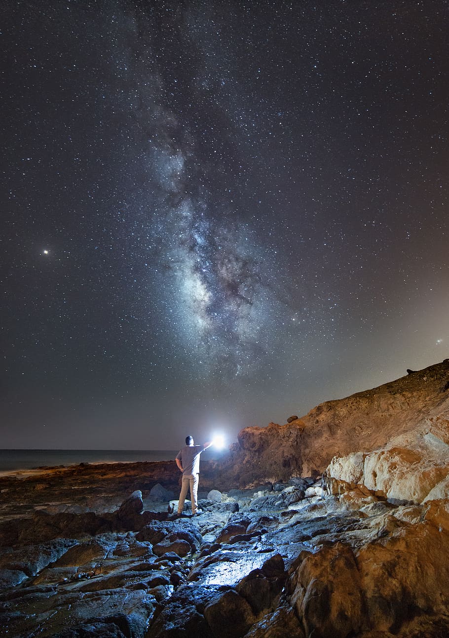 man holding light under night sky, gran canaria, spain, grey HD wallpaper