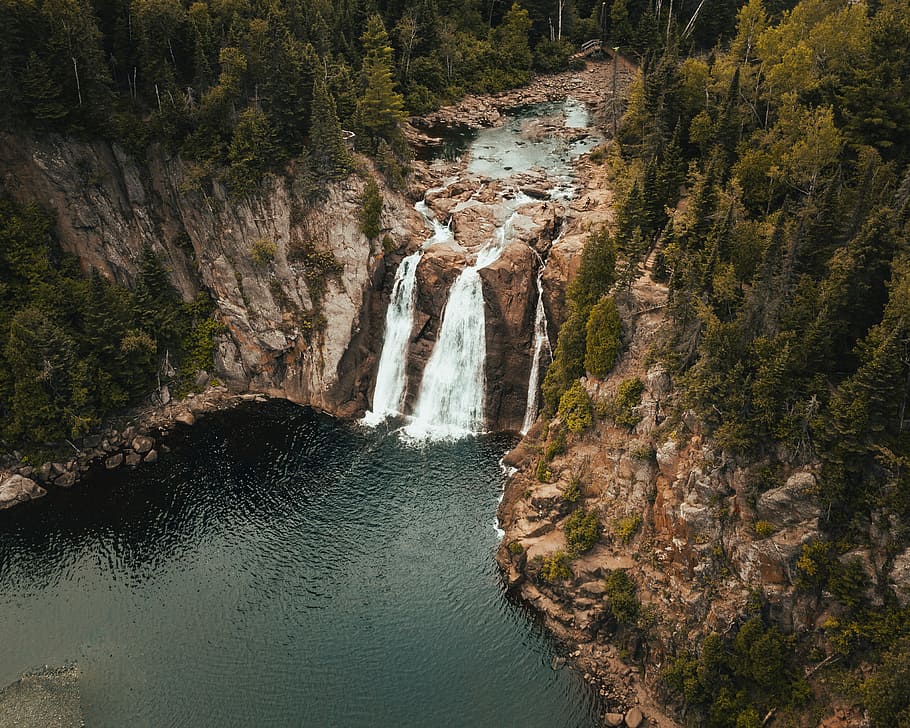 aerial view photography of waterfalls surrounded by pine trees HD wallpaper