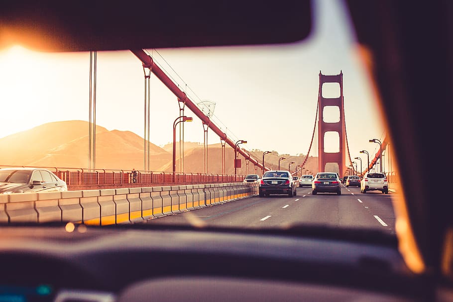 Driving Over The Golden Gate Bridge in Sunset, california, cars