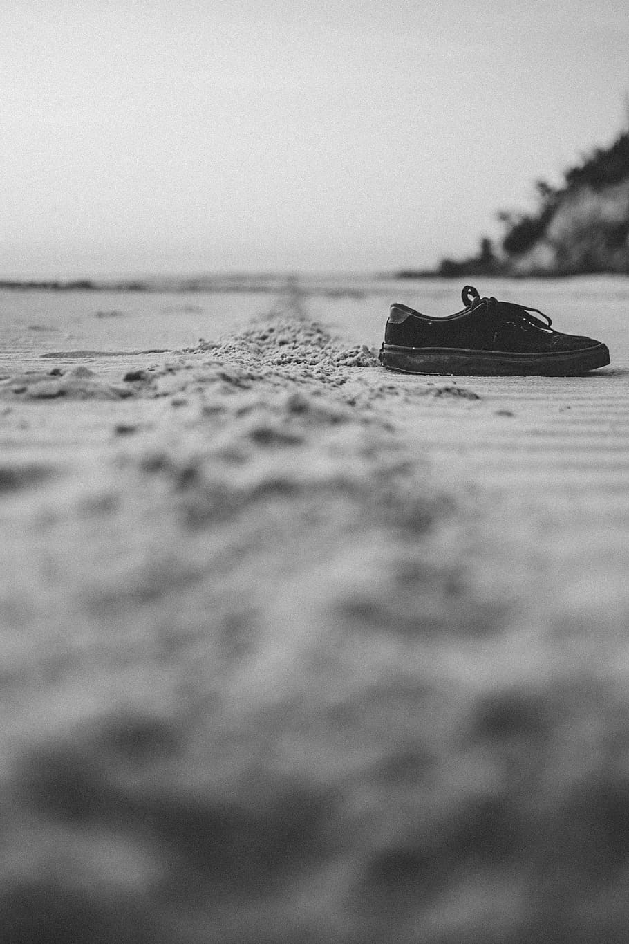 black suede lace-up shoe, bw, van, sunset, beach, sand, sneaker