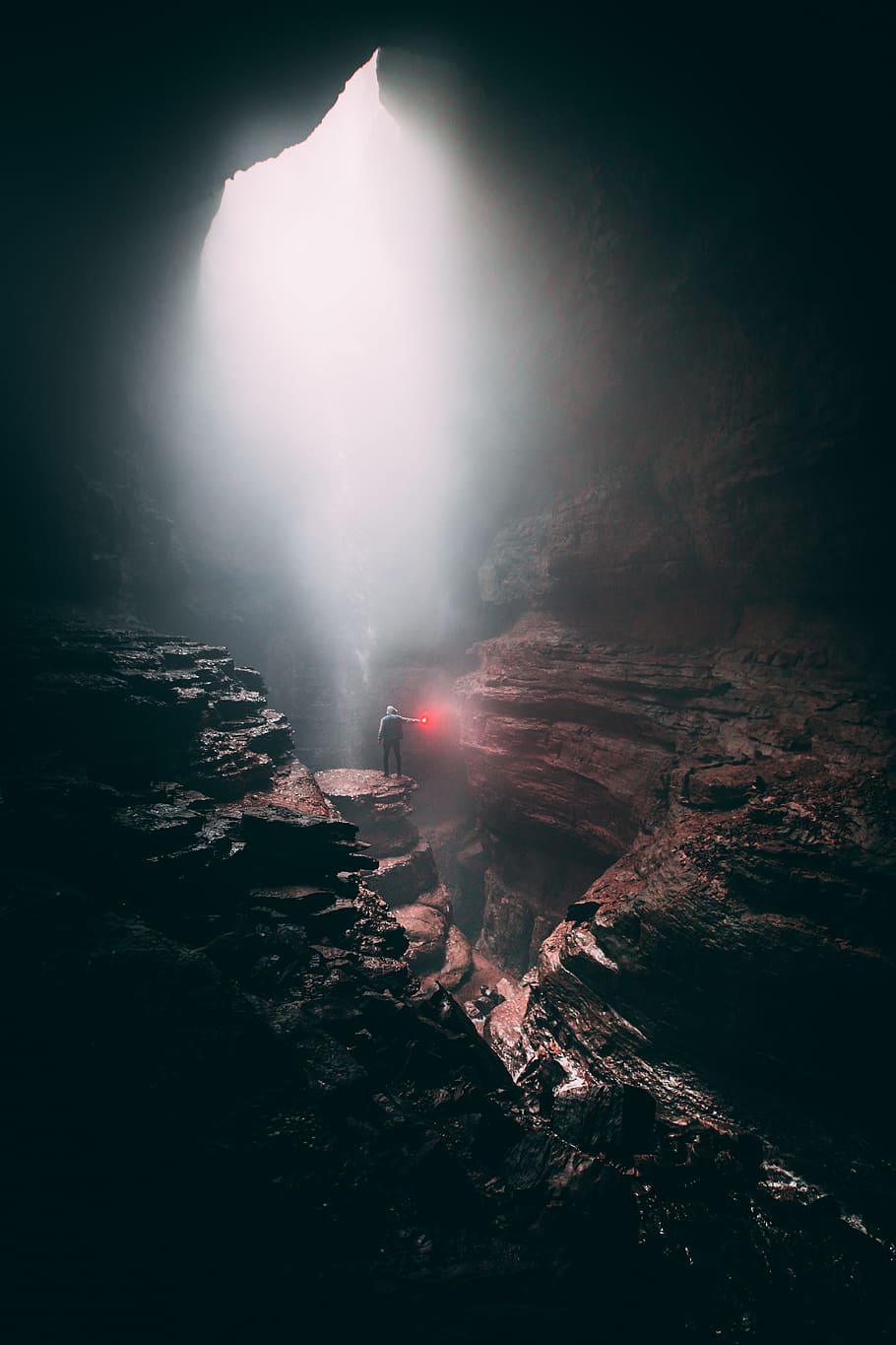 person standing on cliff, mist, cave, flare, man, underground