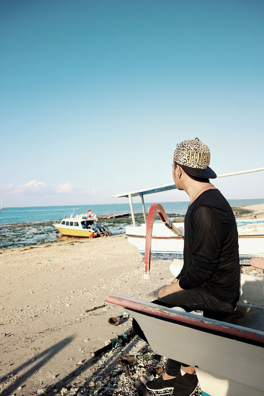 Man Sitting On A Boat, bali, beach, person, sand, sea, seashore HD wallpaper