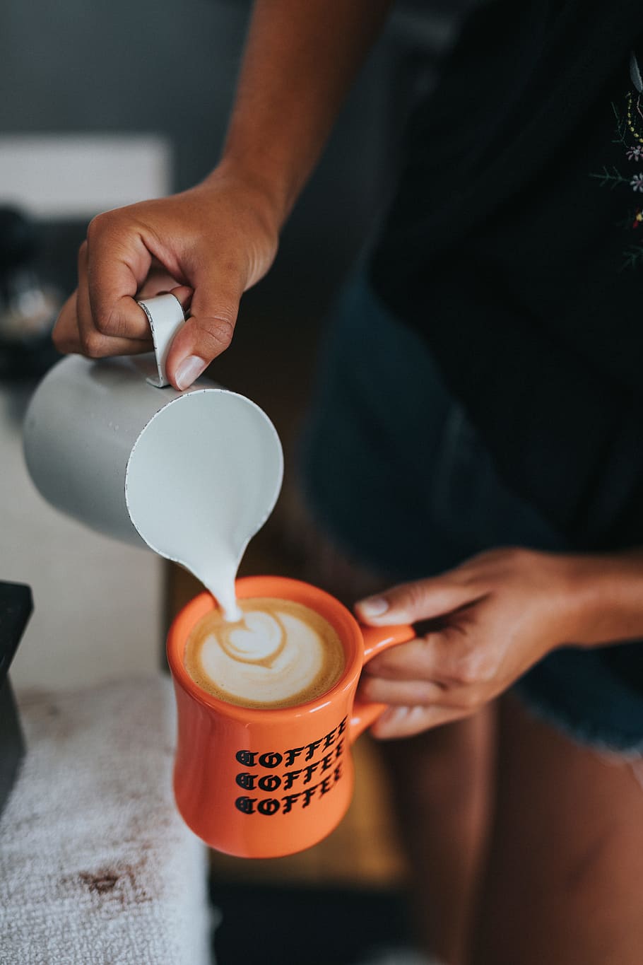 person pouring coffee on orange mug, caffeine, halloween, latte art, HD wallpaper
