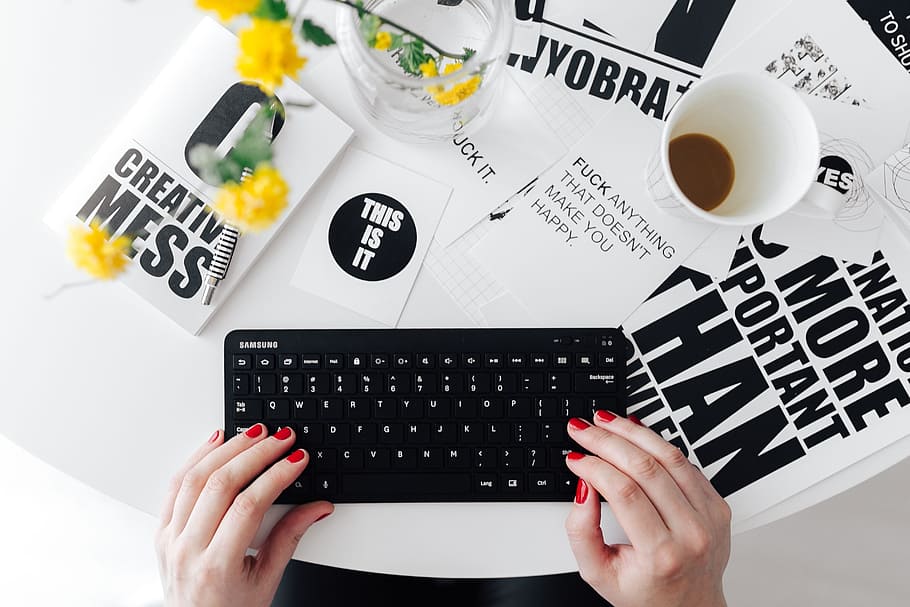 Female hands typing on the remote wireless computer keyboard HD wallpaper