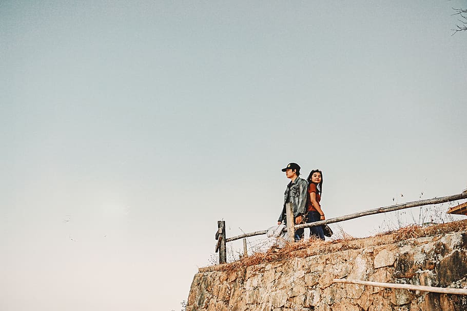 couple standing under white clouds, person, human, adventure HD wallpaper