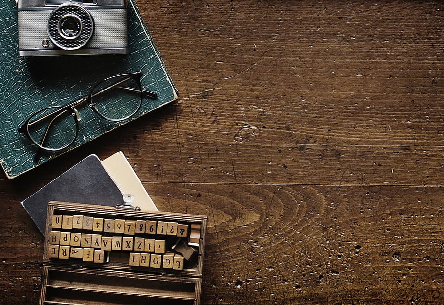 Black Eyeglasses Beside Camera, alphabets, antique, eyewear, rustic HD wallpaper