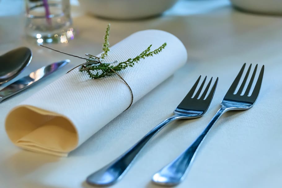 Stainless Steel Fork Beside Rolled Paper Towel With Parsley on Top HD wallpaper