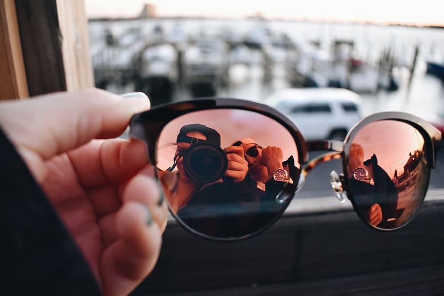 Close-Up Photography of a Person Holding Sunglasses, blur, camera HD wallpaper