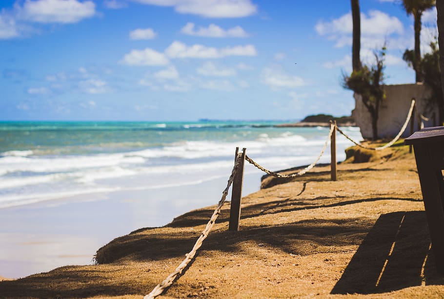 Wooden Posts Near Ocean Water, beach, blue, clouds, daylight HD wallpaper