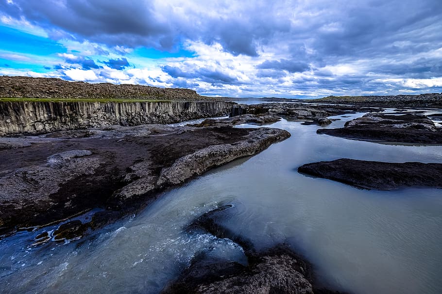 Rock Formation Near Body of Water, clouds, idyllic, nature, river HD wallpaper