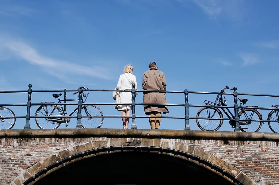 couple standing on bridge, sky, men, railing, architecture, day HD wallpaper