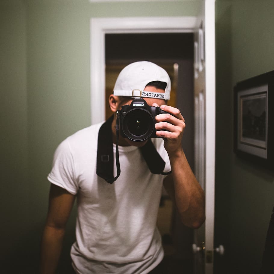 man taking a photo using black DSLR camera, photography themes HD wallpaper
