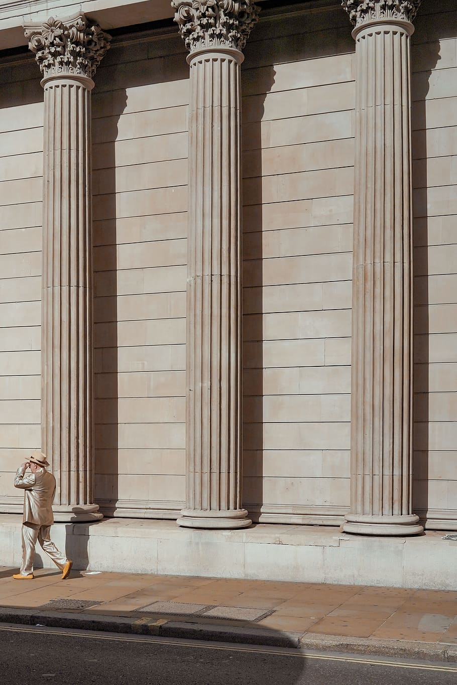 man walking near concrete building, column, pillar, person, street HD wallpaper