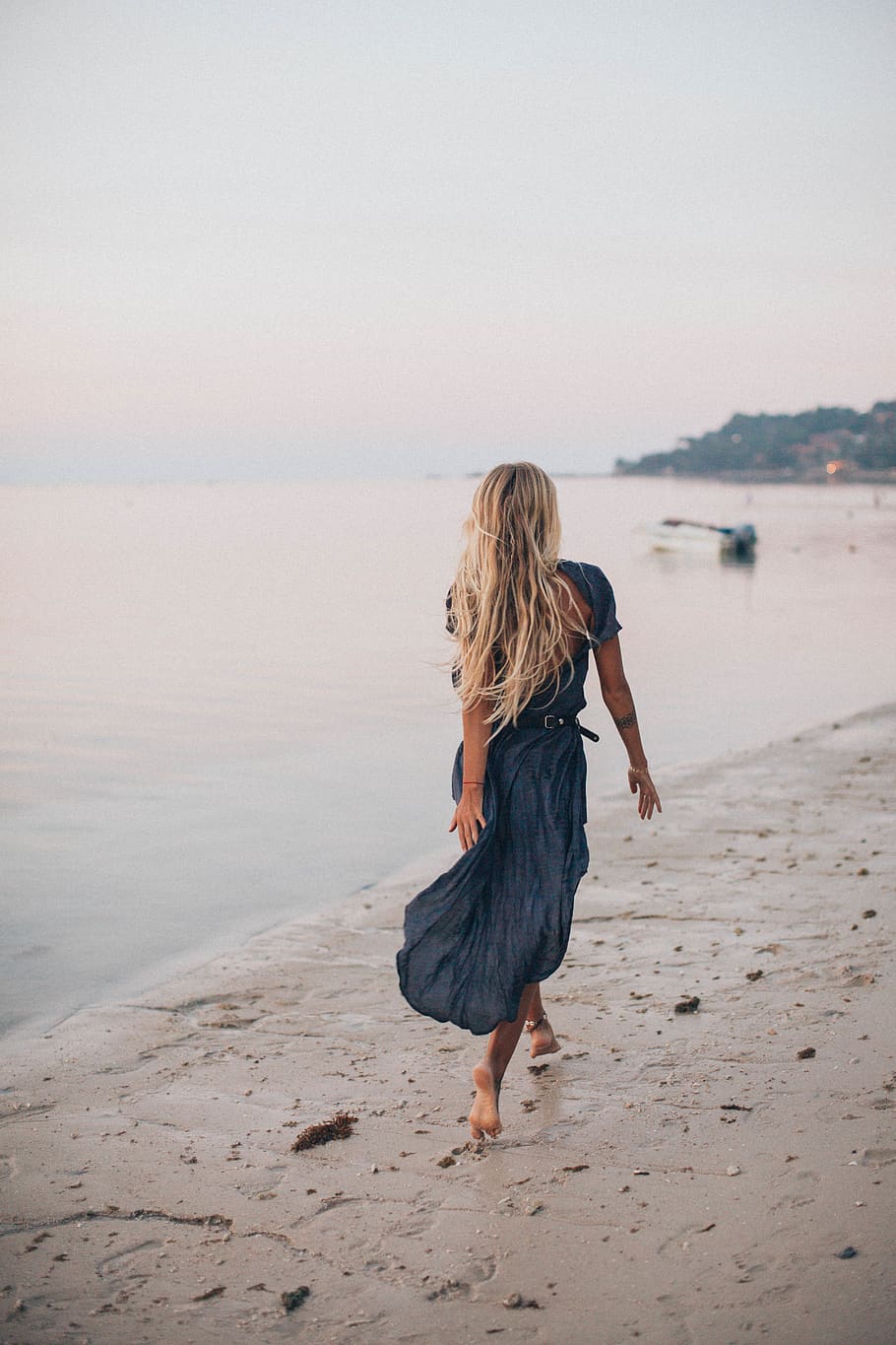 Photo of Woman Walking On Seashore, barefoot, beach, blond, blonde