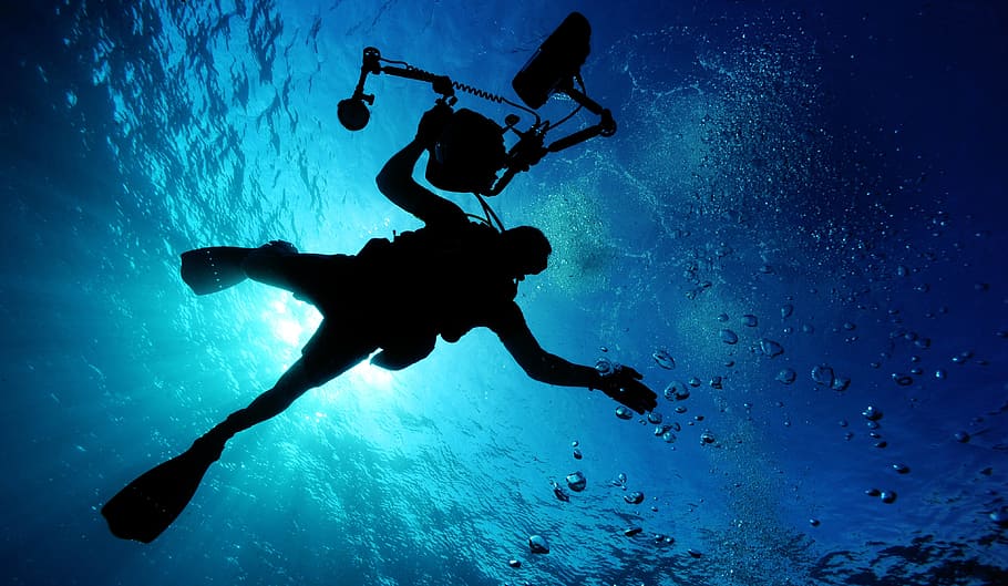 Silhouette of Person Holding Camera in Body of Water, diver, exploring HD wallpaper