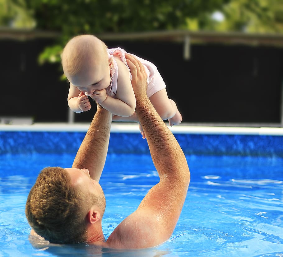 Man in Swimming Pool While Raising Baby Up in, beautiful, child, HD wallpaper