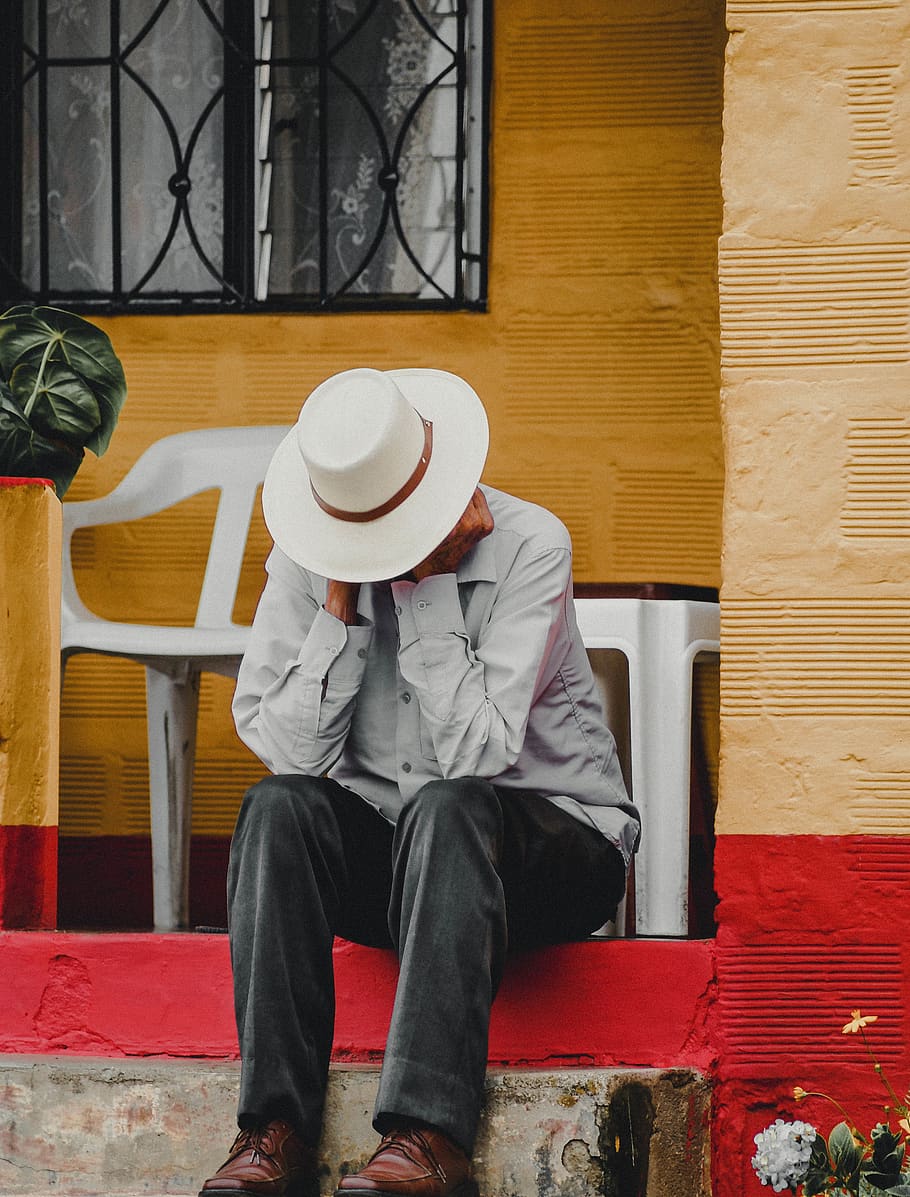 man sitting on floor, hat, real people, one person, men, architecture HD wallpaper