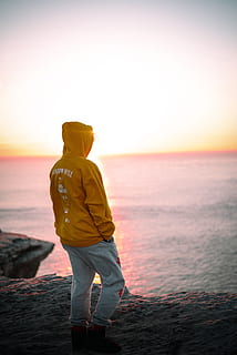 man wearing brown pullover hoodie, clothing, apparel, human, person HD wallpaper