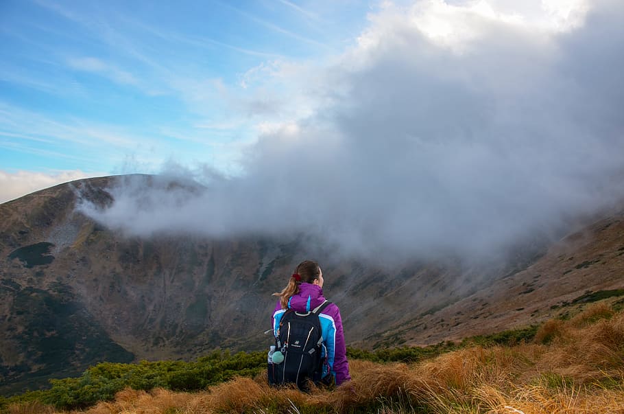 Photography of Woman Sitting on Grass, adventure, backpack, daylight HD wallpaper