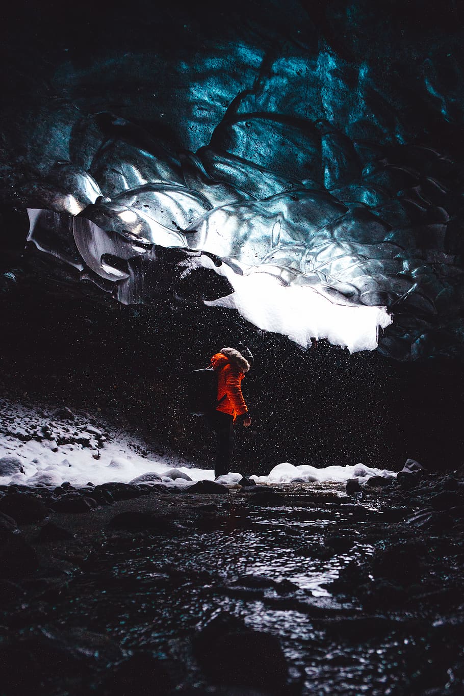 person standing inside the cave, water, one person, real people HD wallpaper