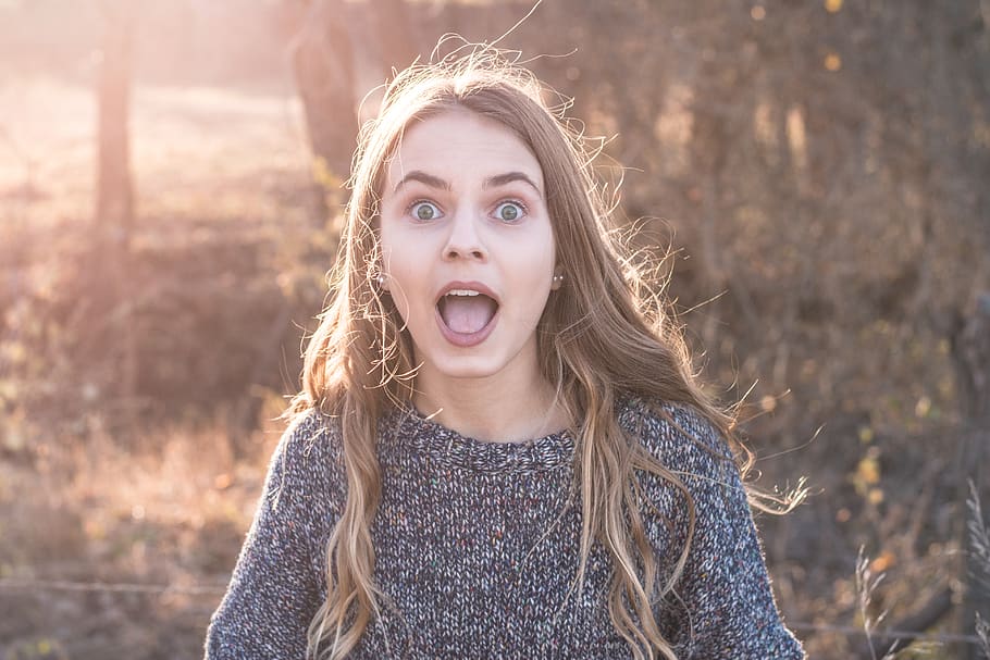 woman standing showing shocking face, hair, hairstyle, child