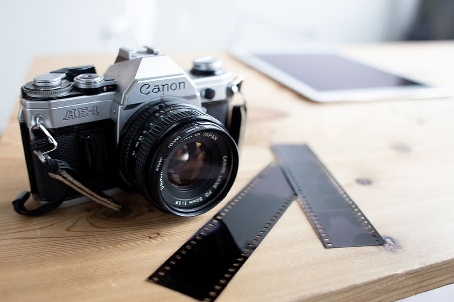 MILC on table, camera, electronics, strap, photographer, wood desk HD wallpaper