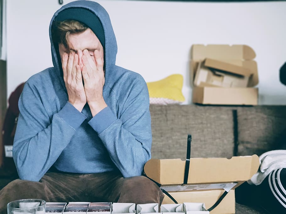man covering face with both hands while sitting on bench, human HD wallpaper