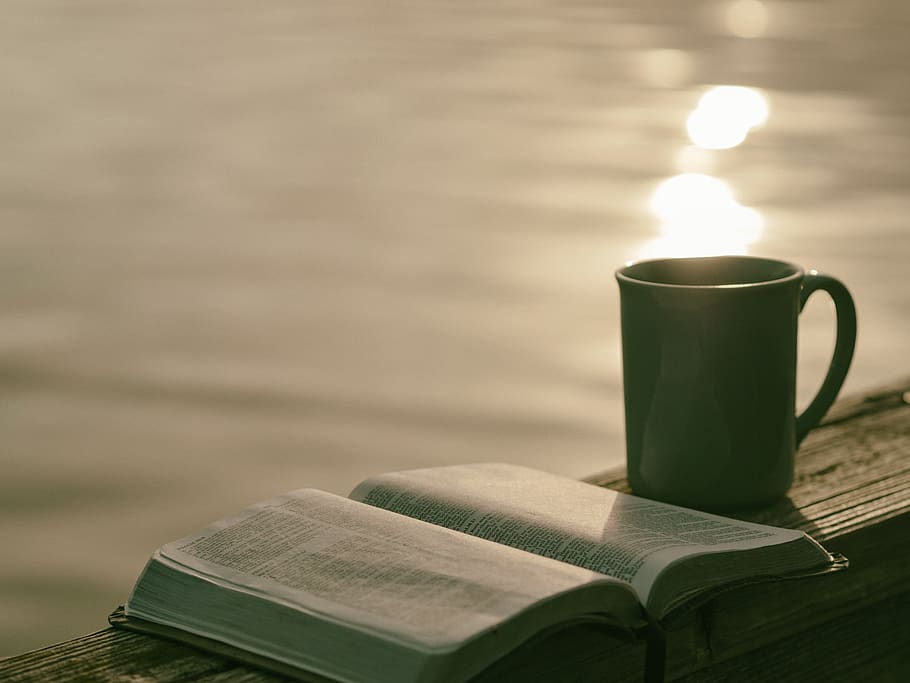green ceramic mug beside book, publication, cup, table, focus on foreground HD wallpaper