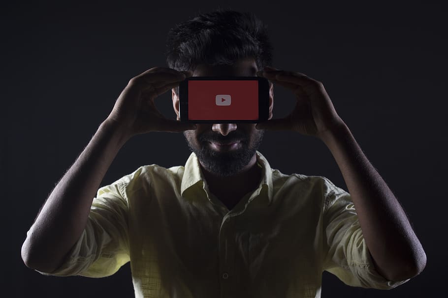 man holding black Android smartphone, one person, studio shot HD wallpaper
