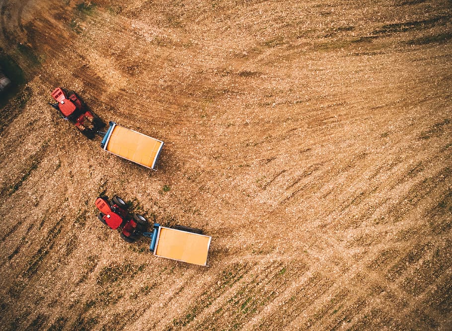 red tractors on field, farm, topdown, pull, carry, two, pair HD wallpaper