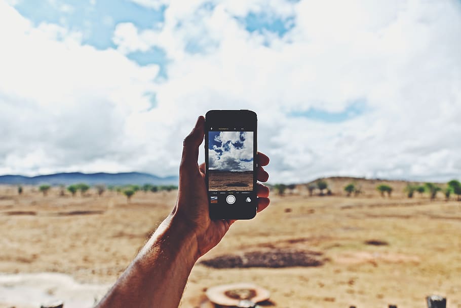 Person Holding Smartphone Showing Cloudy Sky, camera, cellphone HD wallpaper