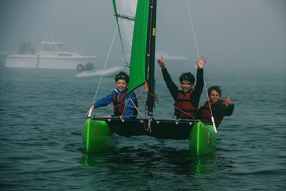 three people riding on boat, watercraft, transportation, vehicle