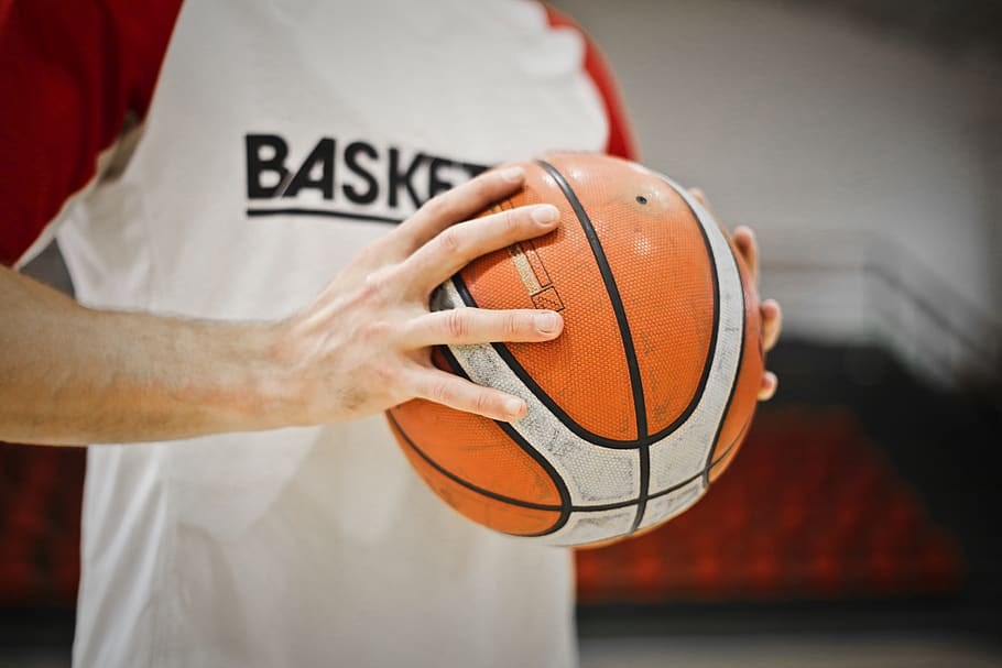 Person Holding White And Orange Basketball, hands, man, player, HD wallpaper