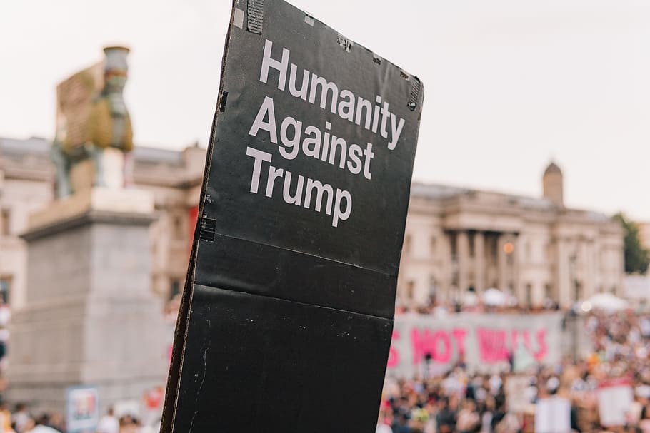 humanity against trump signage near buildings, protest, slogan HD wallpaper