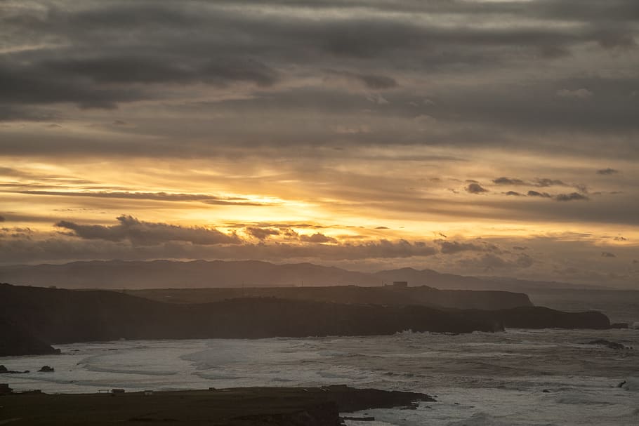 spain, playa tenrero, clouds, sunset, ocean, cloud - sky, beauty in nature HD wallpaper