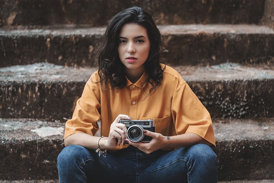 Sitting Woman Holding Gray Point-and-shoot Camera, adolescent