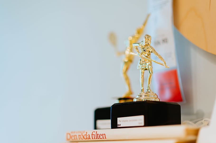gold-colored trophy, human, person, toy, gold medal, stage, coat rack HD wallpaper