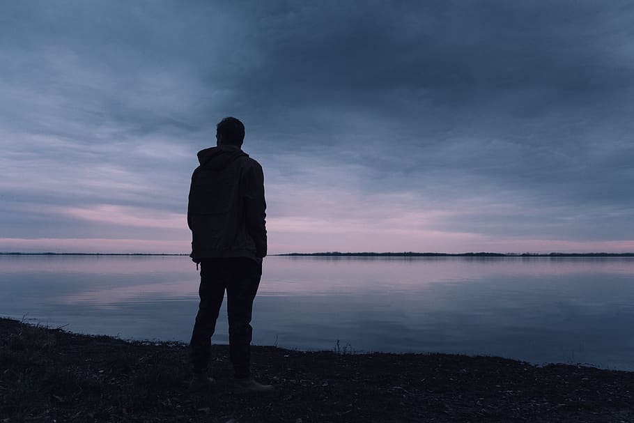 Person Standing Near Lake, clouds, golden hour, hands, jacket HD wallpaper