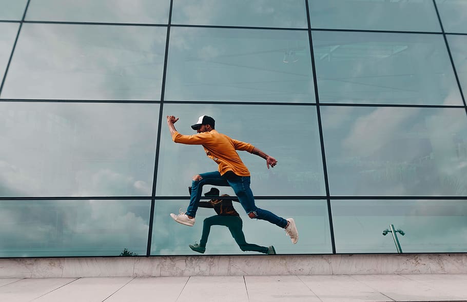 Man Running Beside Mirror Wall, architecture, glass, motion, person HD wallpaper