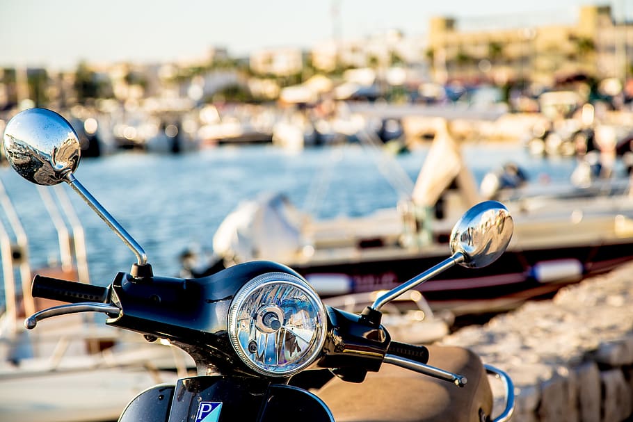 Photo of Black Motorcycle, bay, beach, blurred, boats, dock, headlight HD wallpaper